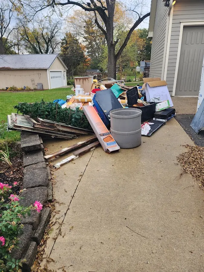 Dumpster being loaded with debris for 3 Yard Dumpster Rental in Wood River